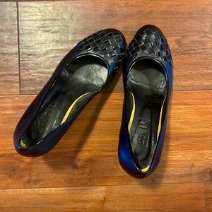 Pair of elegant black leather high heels